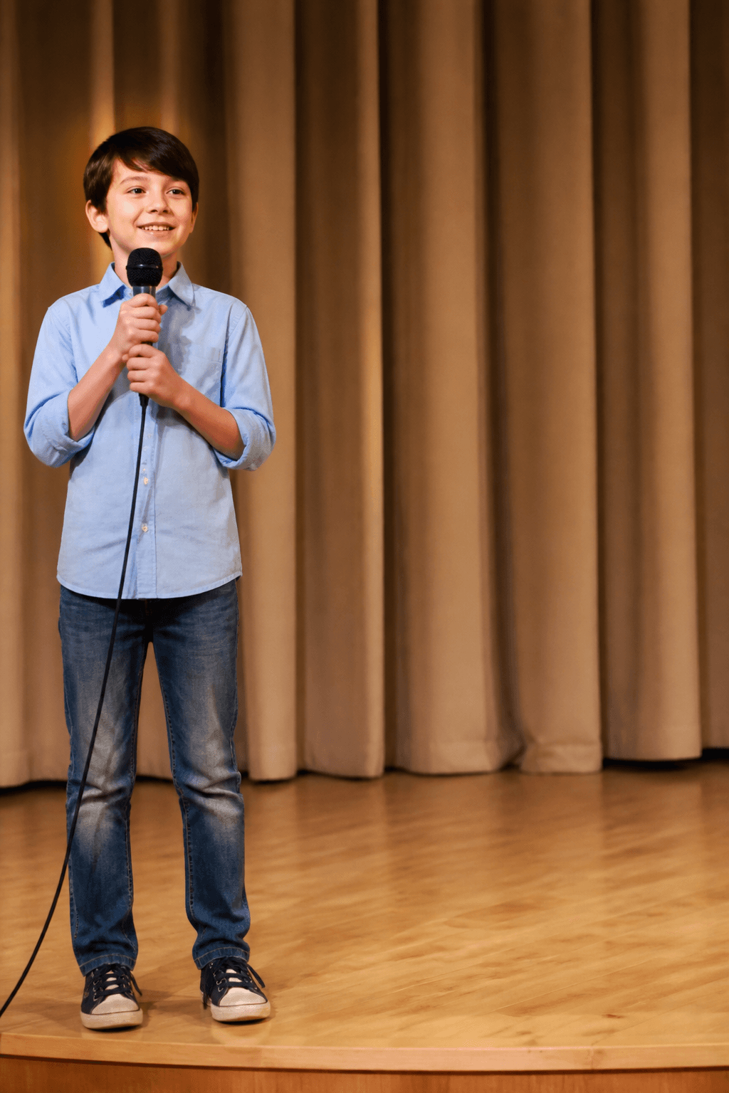 Child singing alone on a small stage before the prompt edit