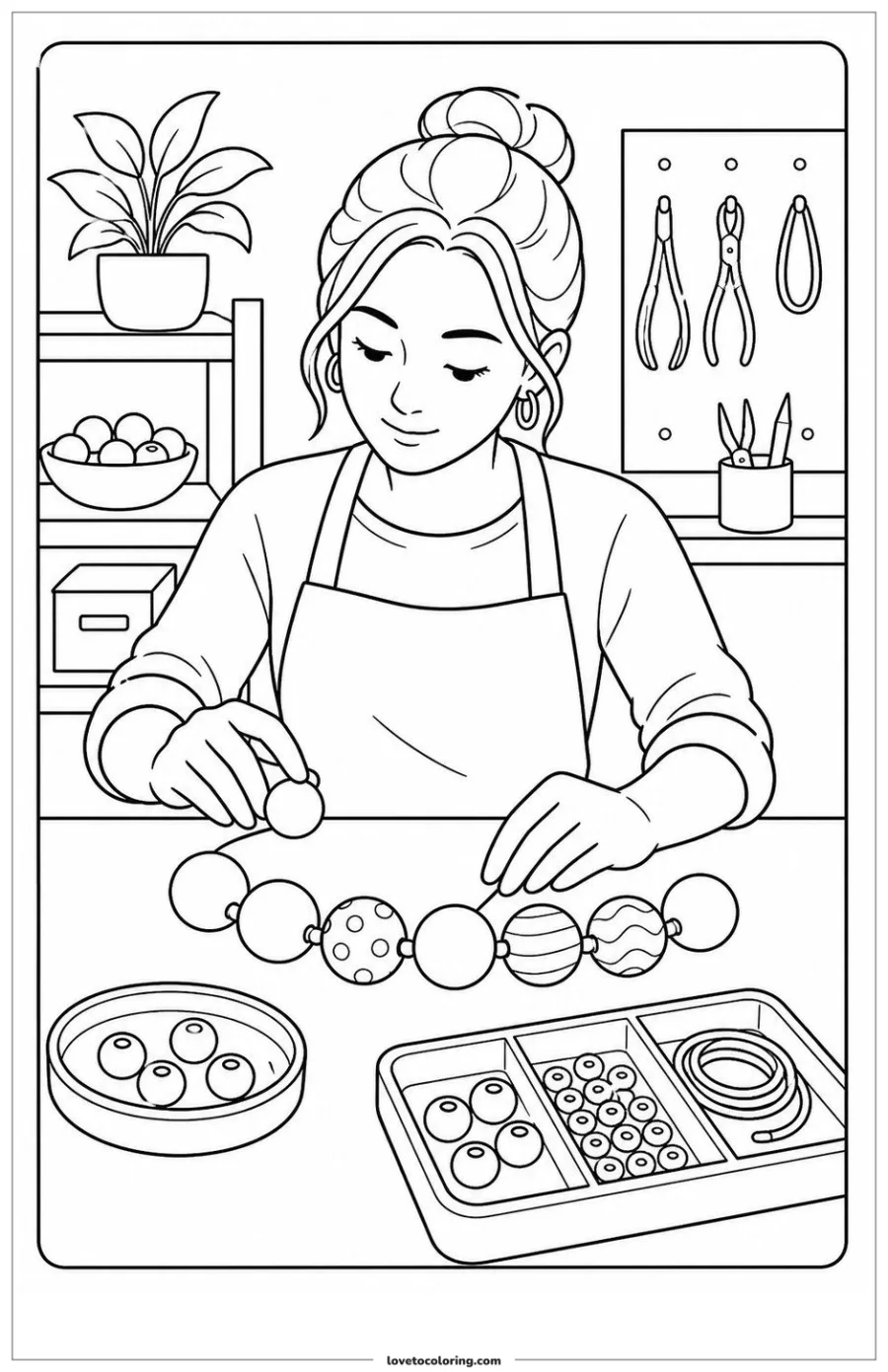 Jewelry maker arranging beads on a tray at a craft worktable.